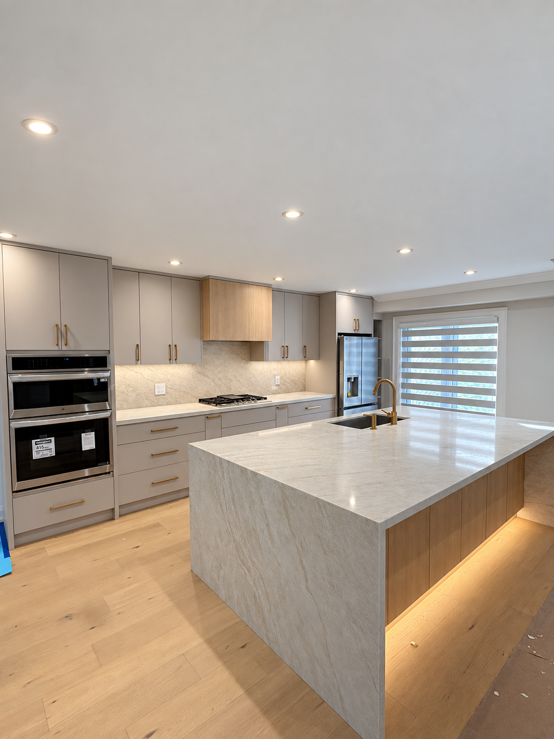 Vertical view of the completed kitchen and waterfall island